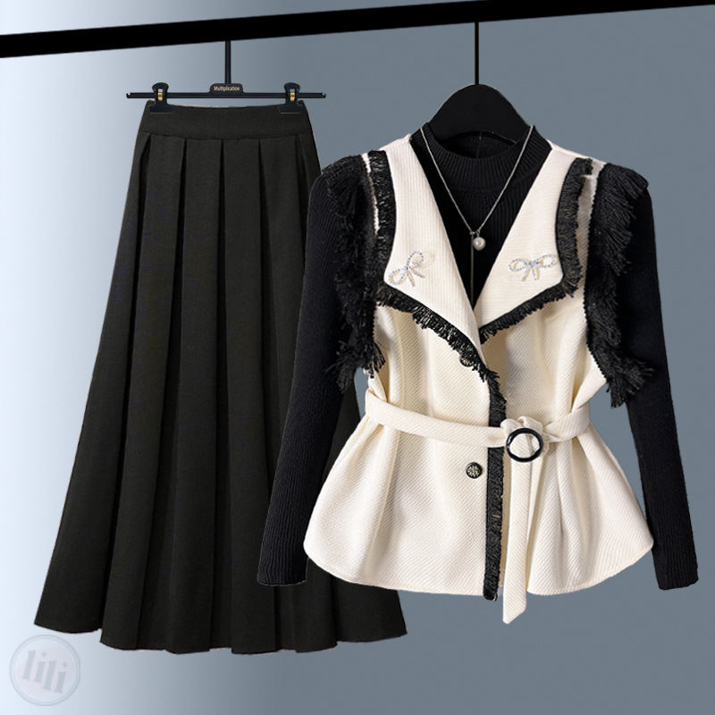 白色馬甲+黑色毛衣++黑色半身裙